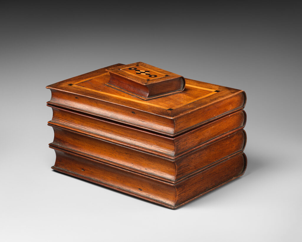 Antique wooden tea caddy shaped like a stacked books, symbolizing literary tradition