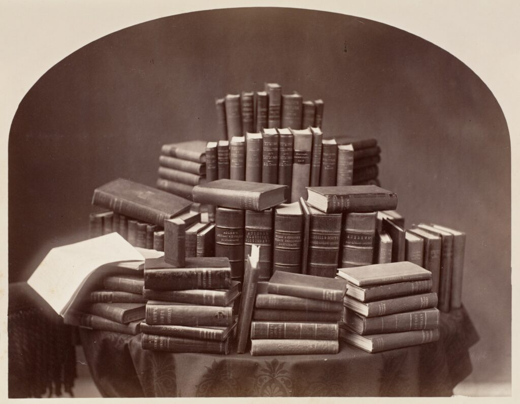 A large stack of books symbolizing collected works and literary tradition of African American poets.