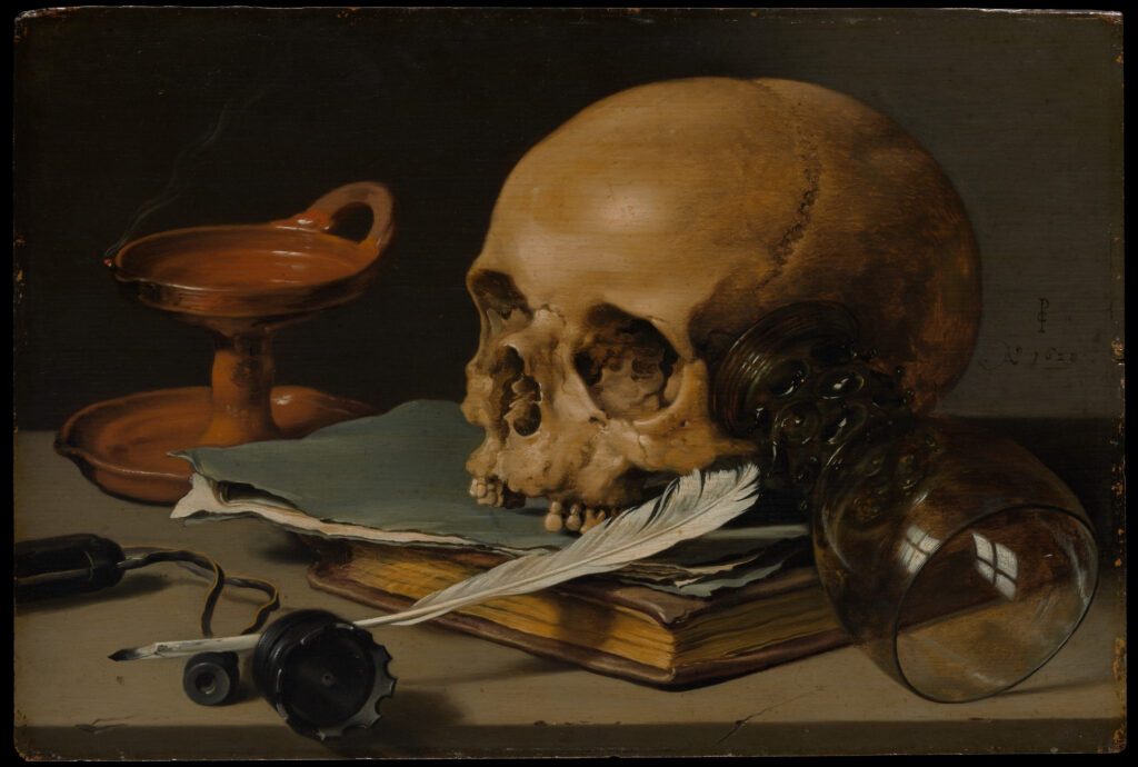 Vanitas still life painting of a skull resting on books with a quill and oil lamp, symbolizing mortality